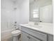 Bathroom featuring a shower/tub combo, tile floors, toilet and vanity with cultured marble countertop at 2526 Knob Creek Dr, Snellville, GA 30078