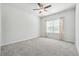 Bright bedroom with a ceiling fan and neutral carpet, offering a serene and comfortable space at 2526 Knob Creek Dr, Snellville, GA 30078