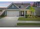 Charming single-Gathering home featuring a two-car garage, manicured lawn, and inviting curb appeal at 2526 Knob Creek Dr, Snellville, GA 30078