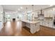 Open kitchen with an island, stainless steel appliances, and views of the living area at 2526 Knob Creek Dr, Snellville, GA 30078
