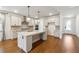 Bright kitchen features an island, granite countertops, and stylish pendant lighting at 2526 Knob Creek Dr, Snellville, GA 30078