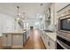 Open kitchen with an island, stainless steel appliances, and views of the living area at 2526 Knob Creek Dr, Snellville, GA 30078