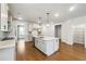 Spacious kitchen with an island, stainless steel appliances, and stylish pendant lighting at 2526 Knob Creek Dr, Snellville, GA 30078