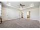 Spacious main bedroom with plush carpet and an ensuite bathroom access at 2526 Knob Creek Dr, Snellville, GA 30078