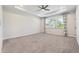 Large primary bedroom with tray ceiling, neutral carpet, and windows for natural light at 2526 Knob Creek Dr, Snellville, GA 30078