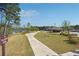 Enjoy the community walking trail with lake views and outdoor seating areas at 2526 Knob Creek Dr, Snellville, GA 30078
