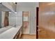 Bathroom featuring a long vanity with large mirror and access to a second bathroom at 2963 Williams Pl, Snellville, GA 30078