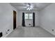 Bedroom featuring neutral carpet, window with decorative curtains, and a closed door at 2963 Williams Pl, Snellville, GA 30078
