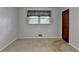 Cozy bedroom features neutral walls, carpet flooring, and a window with gray and black valance at 2963 Williams Pl, Snellville, GA 30078