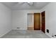 Bedroom featuring neutral carpet, closed door, and view into an adjacent room at 2963 Williams Pl, Snellville, GA 30078