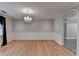 Dining room featuring hardwood floors, elegant wainscoting, and a decorative chandelier at 2963 Williams Pl, Snellville, GA 30078