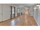 Bright living room featuring hardwood floors, large windows, and decorative light fixtures at 2963 Williams Pl, Snellville, GA 30078