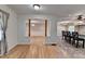 Open-concept living area showcasing hardwood floors and decorative columns leading to the dining and kitchen areas at 2963 Williams Pl, Snellville, GA 30078