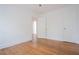 Bedroom featuring hardwood floors and multiple doors at 3078 Semmes St, East Point, GA 30344