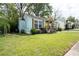 Charming home featuring a cheerful yellow door, window boxes, and a well-manicured front yard at 3078 Semmes St, East Point, GA 30344