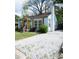 Charming home with light blue siding, a cheerful yellow front door, and a well-maintained yard at 3078 Semmes St, East Point, GA 30344