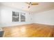 Bright living room with hardwood floors, ceiling fan, and ample natural light at 3078 Semmes St, East Point, GA 30344