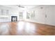 Bright living room with hardwood floors, fireplace, and plenty of natural light from large windows at 3078 Semmes St, East Point, GA 30344