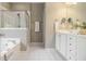 Bright bathroom with double vanity, soaking tub, and glass-enclosed shower at 3499 Henderson Reserve, Atlanta, GA 30341
