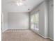 Bedroom with neutral walls, ceiling fan and large window offering plenty of natural light at 3499 Henderson Reserve, Atlanta, GA 30341