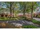 Picturesque common area with mature trees, walking paths, benches, and lush landscaping in this community at 3499 Henderson Reserve, Atlanta, GA 30341