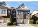 Charming brick townhome with a well-manicured lawn and attached two-car garage at 3499 Henderson Reserve, Atlanta, GA 30341