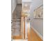 Elegant foyer with a staircase, wood floors, and decorative wall art at 3499 Henderson Reserve, Atlanta, GA 30341