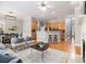 Open-concept living space with a modern kitchen, dining area, and comfortable seating at 3499 Henderson Reserve, Atlanta, GA 30341