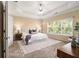 Main bedroom with tray ceiling, ceiling fan, area rug and natural light at 3499 Henderson Reserve, Atlanta, GA 30341