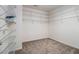 Spacious walk-in closet with shelving and carpeted floor at 3499 Henderson Reserve, Atlanta, GA 30341