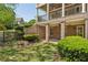 Backyard patio of a brick home, featuring classic architecture and well-maintained landscaping for outdoor living and entertaining at 385 Laurel Chase Ct, Atlanta, GA 30327