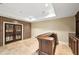 Another view of the bar room shows ample space, brick accent wall, and beautiful view through the doors at 385 Laurel Chase Ct, Atlanta, GA 30327