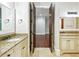 Elegant bathroom with double vanity, granite countertops, and a doorway to the bedroom at 385 Laurel Chase Ct, Atlanta, GA 30327