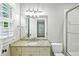 Bathroom with tub shower combo featuring a glass door and granite countertops at 385 Laurel Chase Ct, Atlanta, GA 30327