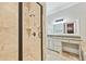 Bathroom featuring tiled walk-in shower and a granite countertop vanity at 385 Laurel Chase Ct, Atlanta, GA 30327