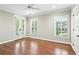 Bedroom with hardwood floors, French doors and large windows with plantation shutters at 385 Laurel Chase Ct, Atlanta, GA 30327