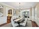 Dining room showcases a dark wood table and wet bar area at 385 Laurel Chase Ct, Atlanta, GA 30327