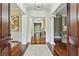 Elegant foyer with hardwood floors, white columns, a neutral palette, and sophisticated lighting at 385 Laurel Chase Ct, Atlanta, GA 30327