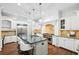 Gourmet kitchen boasts an expansive island, stainless appliances, and custom cabinetry at 385 Laurel Chase Ct, Atlanta, GA 30327