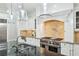 Kitchen island with stone countertops, custom cabinets, and stainless steel appliances at 385 Laurel Chase Ct, Atlanta, GA 30327