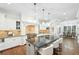 Bright kitchen featuring a large island, stainless appliances, and an adjoining dining area at 385 Laurel Chase Ct, Atlanta, GA 30327