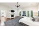 Main bedroom with hardwood floors, fireplace, and French doors at 385 Laurel Chase Ct, Atlanta, GA 30327