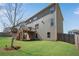 Well-maintained backyard featuring a two-story home with a wooden deck and lush green lawn at 3950 Grandview Manor Dr, Cumming, GA 30028