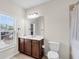 Bathroom featuring a large mirror, a vanity, a toilet, and a shower with a curtain at 3950 Grandview Manor Dr, Cumming, GA 30028