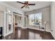 Spacious living space boasts hardwood floors, a decorative ceiling fan, and French doors that provide privacy at 3950 Grandview Manor Dr, Cumming, GA 30028