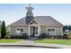 Charming clubhouse with stone accents, a cupola, and well-maintained landscaping at 3950 Grandview Manor Dr, Cumming, GA 30028