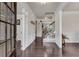 Elegant foyer featuring dark hardwood floors, white trim, and a staircase leading to the second floor at 3950 Grandview Manor Dr, Cumming, GA 30028