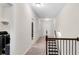 Hallway leading to stairs, bathroom, and the laundry room at 3950 Grandview Manor Dr, Cumming, GA 30028