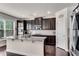 Well-equipped kitchen featuring stainless steel appliances, granite countertops, and dark cabinetry at 3950 Grandview Manor Dr, Cumming, GA 30028