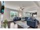 Cozy living room features hardwood floors, a fireplace, and ample natural light, creating a welcoming atmosphere at 3950 Grandview Manor Dr, Cumming, GA 30028